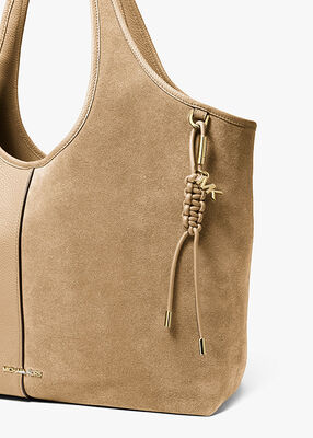 michael kors gold tone and braided cord bag charm