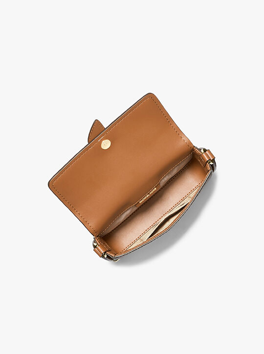 michael kors greenwich extra small logo and faux leather sling crossbody bag