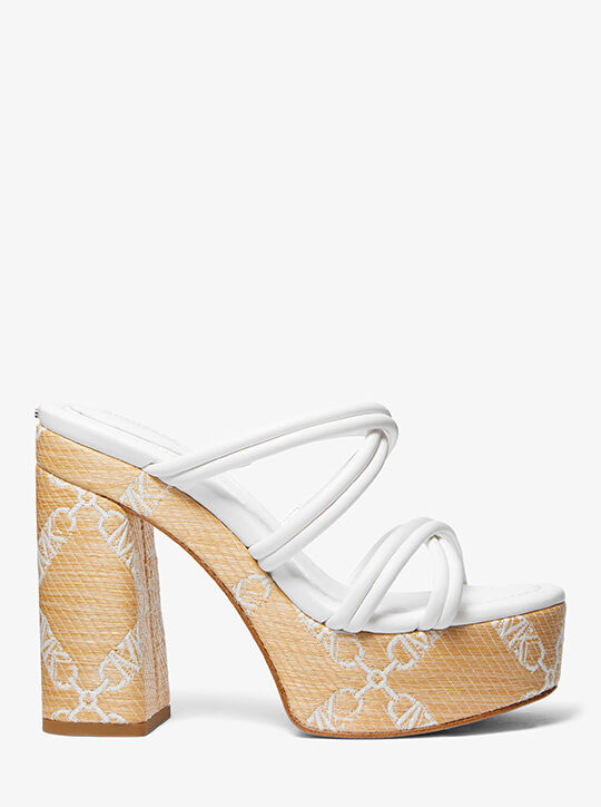 صندل كورين ذو نعل سميك من قماش الجاكار بشعار إمباير michael kors صندل كورين ذو نعل سميك من قماش الجاكار بشعار إمباير