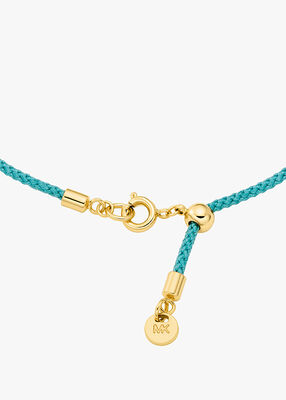 michael kors pav  gold tone logo corded bracelet