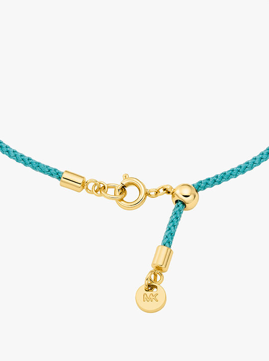 michael kors pav  gold tone logo corded bracelet