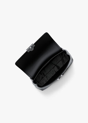 michael kors حقيبة تريبيكا صغيرة جدًا بشعار الماركة