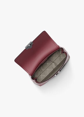 michael kors حقيبة تريبيكا صغيرة جدًا بشعار الماركة