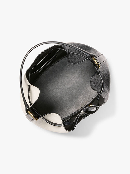 حقيبة ريد متوسطة جلدية مرصعة بالحصى ثنائية اللون michael kors حقيبة ريد متوسطة جلدية مرصعة بالحصى ثنائية اللون